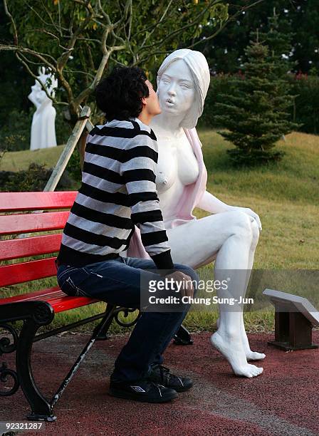 Man enjoys at theme park 'Love Land' on October 24, 2009 in Jeju, South Korea. Love Land is an outdoor sex-themed sculpture park which opened in 2004...