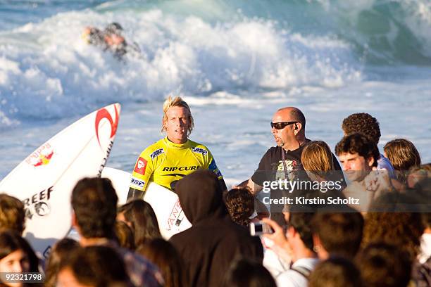 Wildcard surfer Patrick Gudauskas of the United States of America looks over at heat winner Mick Fanning as he exits the water after his round 2...