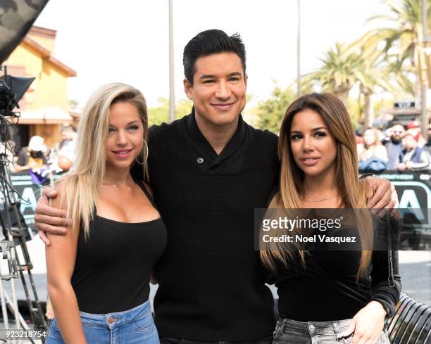Maddy Burciaga, Mario Lopez and Sarah Martins visit "Extra" at Universal Studios Hollywood on February 22, 2018 in Universal City, California.