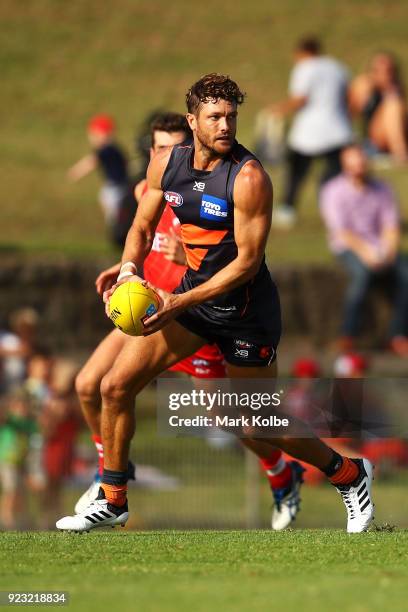 Sam Reid of the Giants runs with the ball during the AFL Inter Club match between the Sydney Swans and the Greater Western Sydney Giants at Henson...