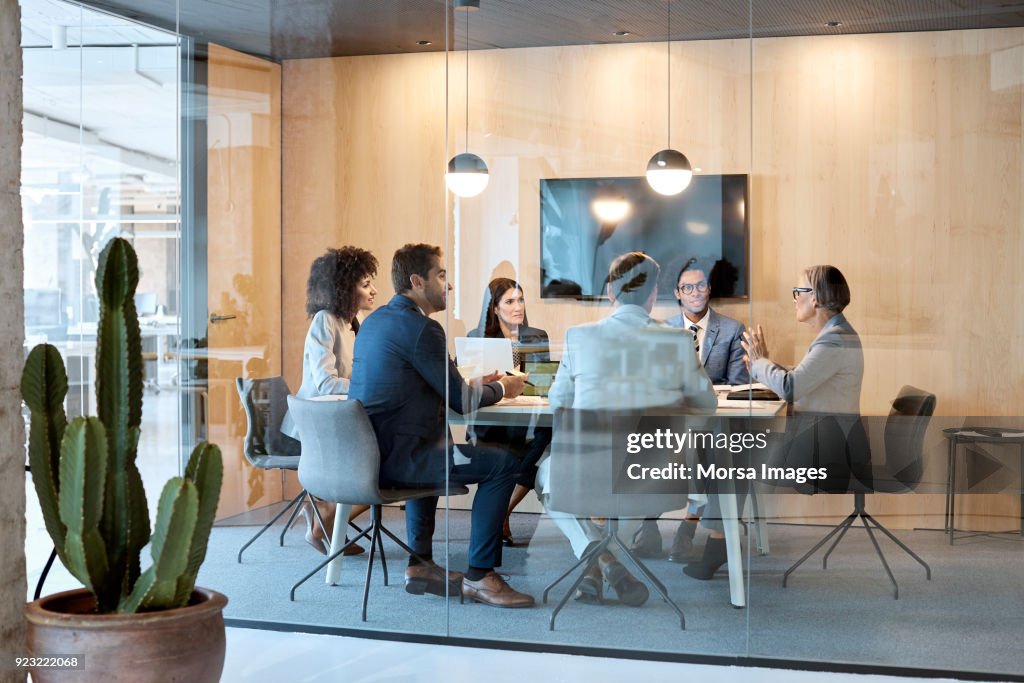 Senior businesswoman explaining strategy at office