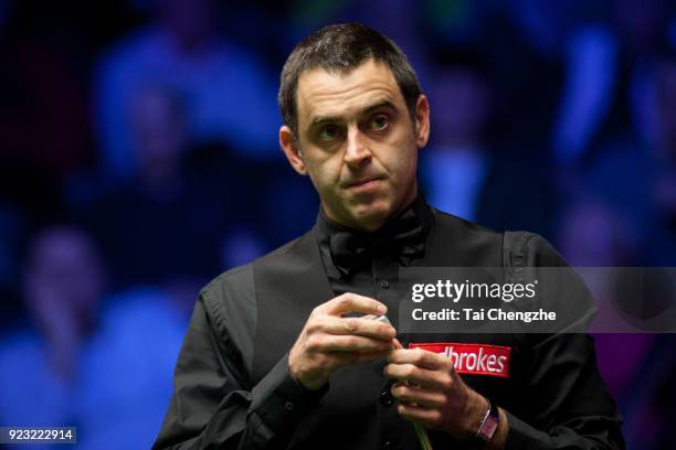 Ronnie O'Sullivan of England chalks the cue during his second round match against Xiao Guodong of China on day four of 2018 Ladbrokes World Grand...