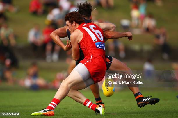 Stephen Coniglio of the Giants is tackled Gary Rohan of the Swans during the AFL Inter Club match between the Sydney Swans and the Greater Western...