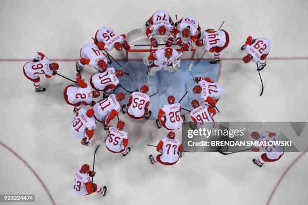 Olympic Athletes from Russia gather around the net before the men's semi-final ice hockey match between the Czech Republic and Olympic Athletes from...