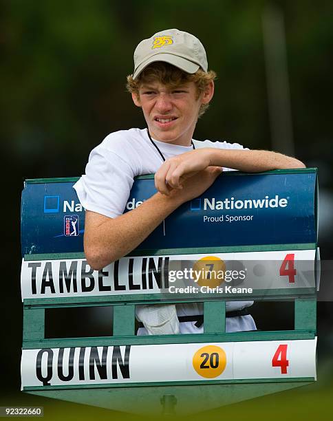 Standard bearer waits for his group to start on the first hole during the third round of the Nationwide Tour Championship at Daniel Island on October...