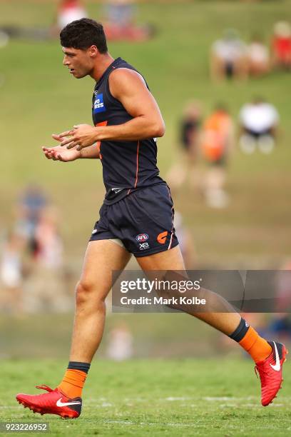 Jonathon Patton of the Giants leaves the field with blood from his mouth during the AFL Inter Club match between the Sydney Swans and the Greater...