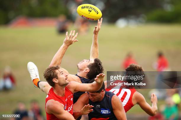 Jeremy Cameron of the Giants attempts to mark under pressure from Nick Smith and Harrison Marsh of the Swans during the AFL Inter Club match between...