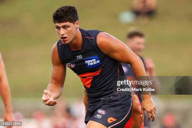 Jonathon Patton of the Giants leaves the field with blood from his mouth during the AFL Inter Club match between the Sydney Swans and the Greater...