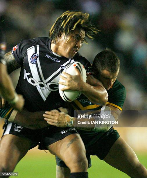Fuifui Moimoi of New Zealand is challenged by Anthony Watmough of Australia during a Four Nations Rugby League Group match at the Twickenham Stoop...