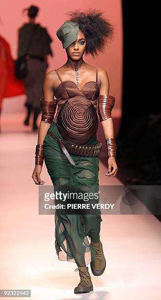Pregnant Jourdan Dunn presents an outfit by French designer Jean Paul Gaultier during ready-to-wear Spring-Summer 2010 fashion show in on October 3,...