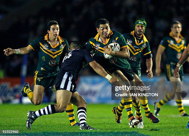 Greg Inglis of Australia is challenged by Thomas Leuluai of New Zealand during a Four Nations Rugby League Group match at the Twickenham Stoop...