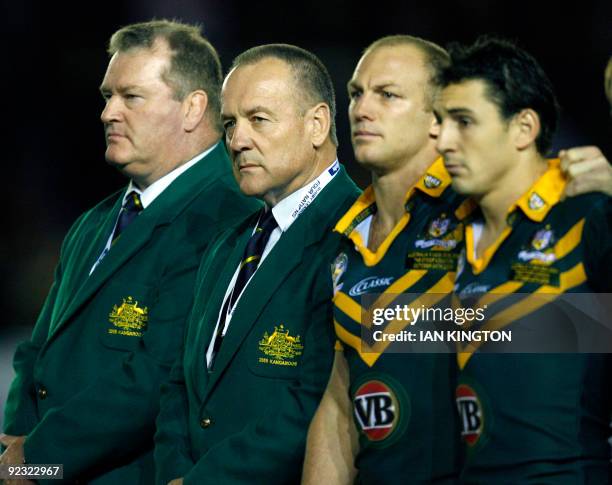 Head coach of Australia Tim Sheens stands with his players for the National Anthems before kick off against New Zealand during a Four Nations Rugby...