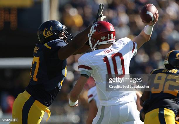 Jeff Tuel of the Washington State Cougars passes against Cameron Jordan of the California Golden Bears at California Memorial Stadium on October 24,...