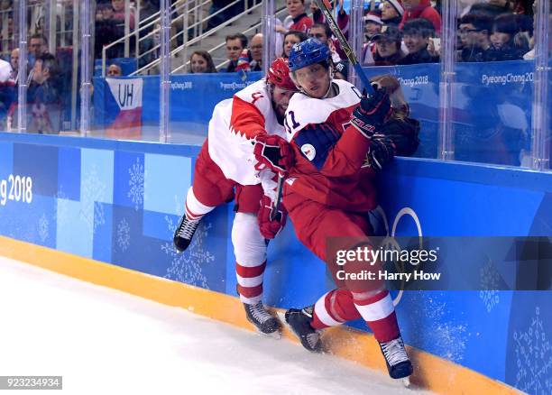 Vladislav Gavrikov of Olympic Athlete from Russia collidea with Martin Erat of the Czech Republic in the first period during the Men's Play-offs...