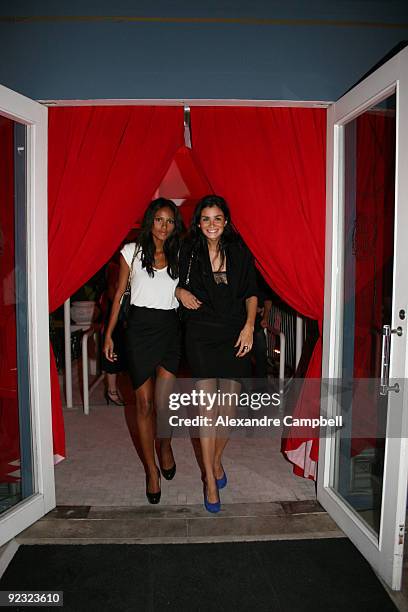 Brazilian models Emanuela de Paula and Carol Ribeiro arrive at the 'Mario de Janeiro Testino' book launching during the opening dinner and charity...