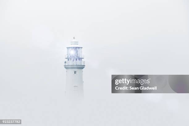 lighthouse in fog - giving directions stock pictures, royalty-free photos & images