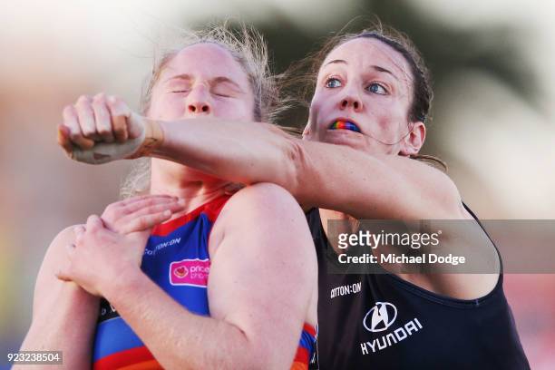 Alison Downie of the Blues punches Aasta O'Connor of the Bulldogs during the round four AFLW match between the Western Bulldogs and the Carlton Blues...