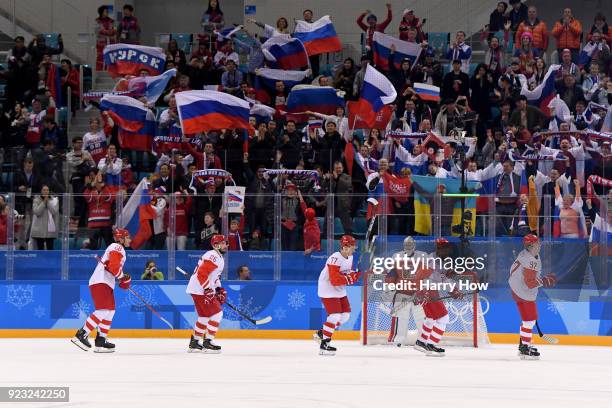 Nikita Gusev of Olympic Athlete from Russia celebrates with teammates after scoring a goal in the second period against Pavel Francouz of the Czech...