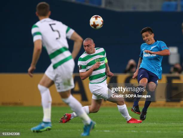 Scott Brown of Celtic and Matías Kranevitter of FC Zenit Saint Petersburg vie for the ball during the UEFA Europa League Round of 32 football match...