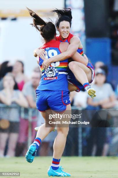 Brooke Lochland of the Bulldogs celebrates a goal as she is hoisted up by Boonie Toogood during the round four AFLW match between the Western...