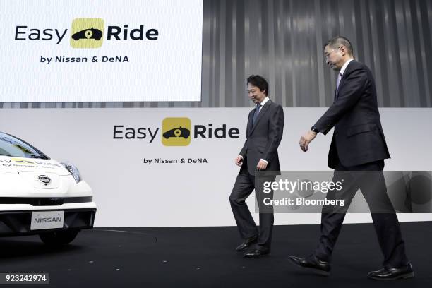 Isao Moriyasu, president and chief executive officer of DeNA Co., left, and Hiroto Saikawa, president and chief executive officer of Nissan Motor...