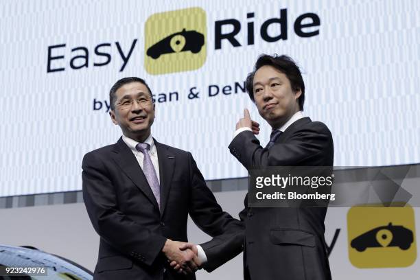 Hiroto Saikawa, president and chief executive officer of Nissan Motor Co., left, and Isao Moriyasu, president and chief executive officer of DeNA...