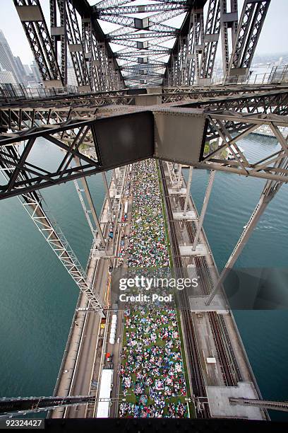 Picnic goers gather during a picnic breakfast on the Sydney Harbour Bridge on October 25, 2009 in Sydney, Australia. For the first time in its...