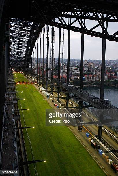 Grass is laid out at dawn ahead of a picnic breakfast on the Sydney Harbour Bridge on October 25, 2009 in Sydney, Australia. For the first time in...