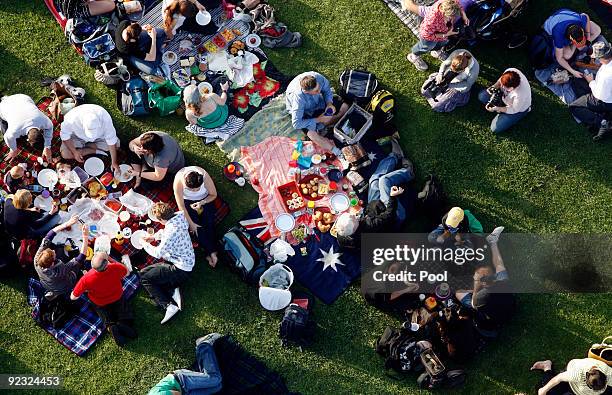 Picnic goers gather during a picnic breakfast on the Sydney Harbour Bridge on October 25, 2009 in Sydney, Australia. For the first time in its...