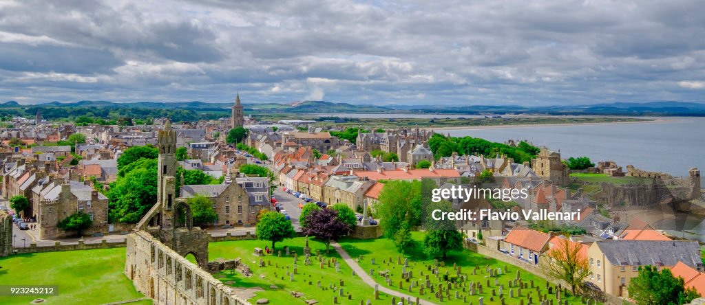 The town of St Andrews seen from the St Rule's tower. You can see the ruins of the Cathedral, built in 1158, and the ruins of the Castle, dating to the 1200s. St Andrews, Fife, Scotland.