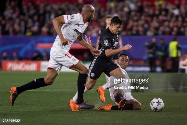 Of Manchester is tackled by LUIS MURIEL of Sevilla during the UEFA Champions League Round of 16 First Leg match between Sevilla FC and Manchester...