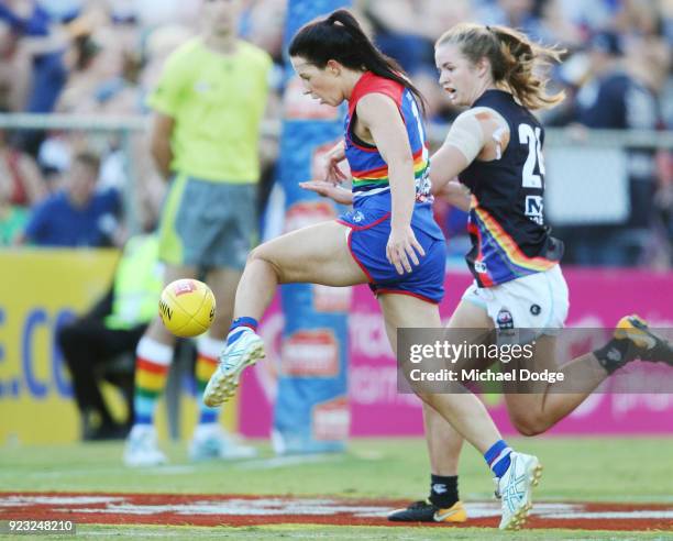 Brooke Lochland of the Bulldogs kicks the ball for a soccer style goal against Kate Shierlaw of the Blues during the round four AFLW match between...