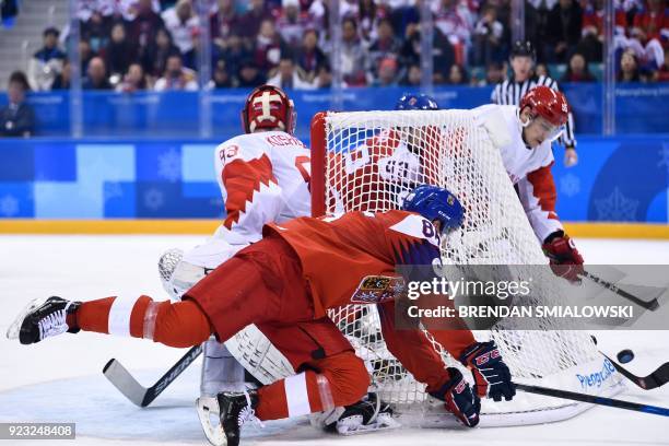 Czech Republic's Tomas Mertl falls in front of the net in the men's semi-final ice hockey match between the Czech Republic and the Olympic Athletes...