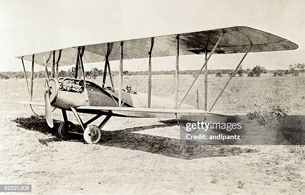 old bi-plane - antique airplane stock pictures, royalty-free photos & images