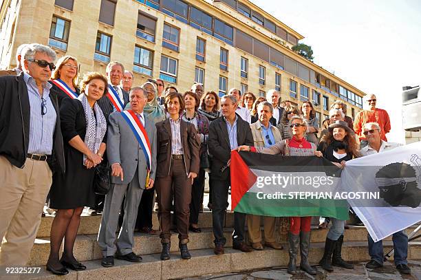 Palestinian Delegate General in France, Hind Khoury , Deputy Mayor Simon Renucci , and Jordan's ambassador to France, Dina Kawar , pose with members...