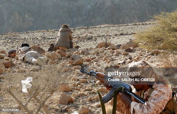 Yemeni fighters loyal to the government backed by the Saudi-led coalition fighting in the country take position as they close in on a suspected...