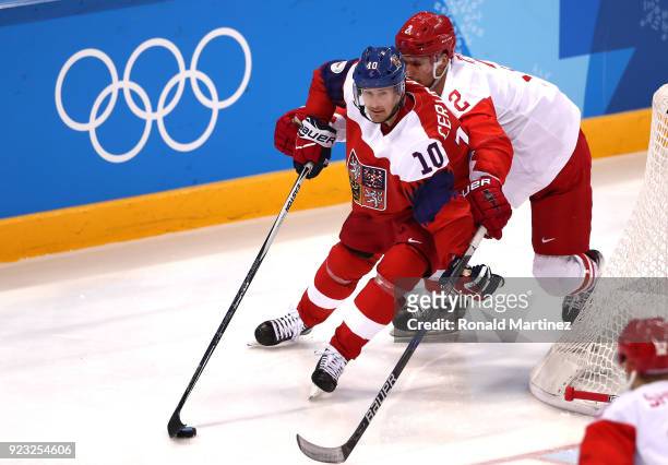 Roman Cervenka of the Czech Republic controls the puck against Artyom Zub of Olympic Athlete from Russia in the third period during the Men's...