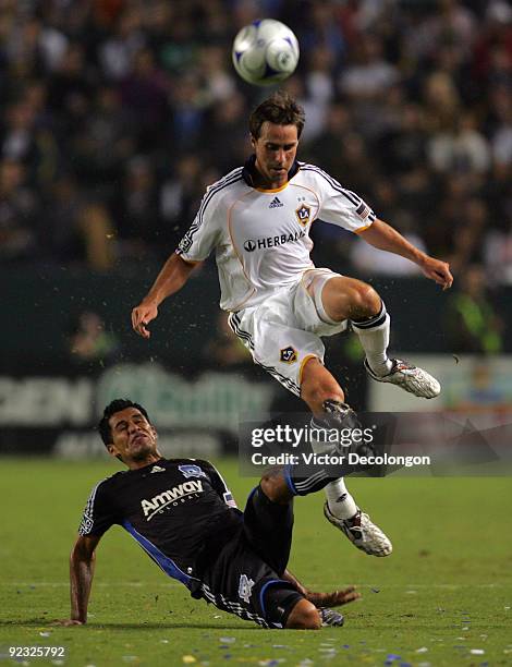 Todd Dunivan of the Los Angeles Galaxy and Ramon Sanchez of the San Jose Earthquakes vie for the ball in the first half during the MLS match at The...