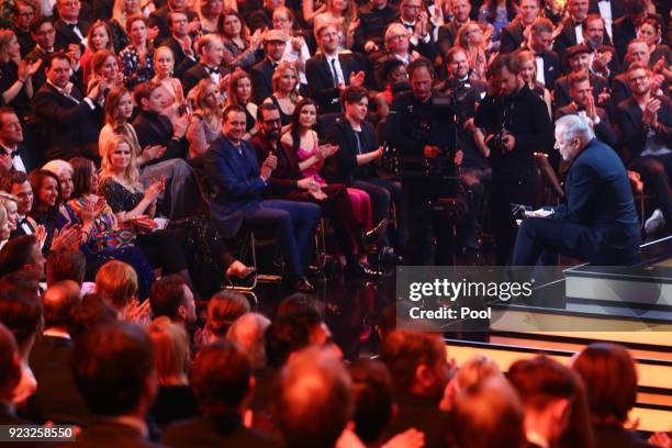 Axel Milberg sits on stage during the Goldene Kamera awards at Messehallen on February 22, 2018 at the Messe Hamburg in Hamburg, Germany.