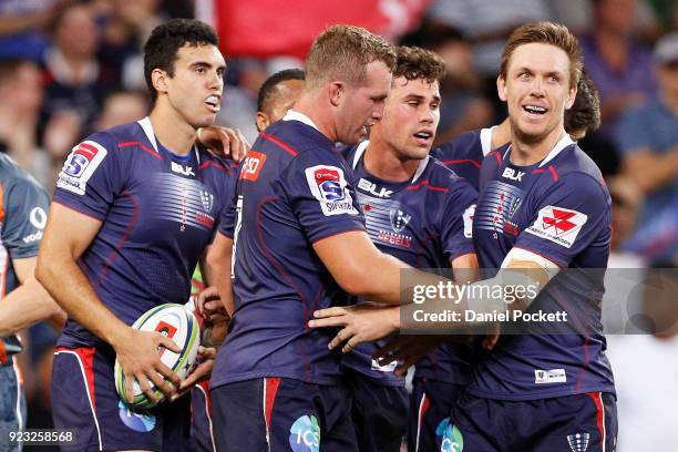 Tom English of the Rebels celebrates a try with teammates during the round two Super Rugby match between the Melbourne Rebels and the Queensland Reds...