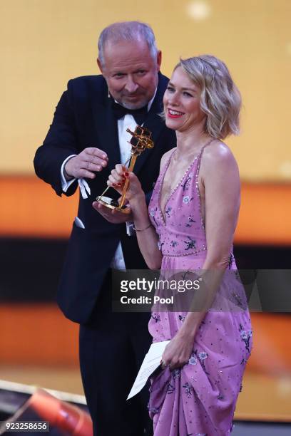 Axel Milberg presents Naomi Watts with her award on stage during the Goldene Kamera awards at Messehallen on February 22, 2018 at the Messe Hamburg...