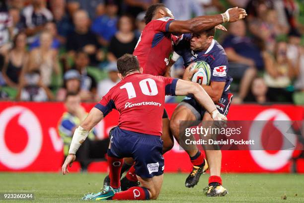 Tom English of the Rebels defends a tackle during the round two Super Rugby match between the Melbourne Rebels and the Queensland Reds at AAMI Park...