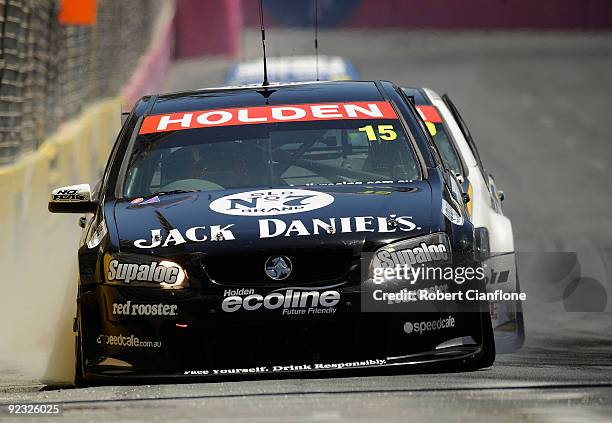 Rick Kelly driving the Kelly Racing Holden locks up during race 20A in round 11 of the V8 Supercar Championship Series at the Surfers Paradise Street...