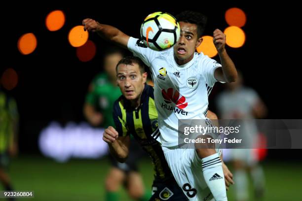 Sarpreet Singh of the Phoenix Contests the ball with Alan Baro of the Mariners during the round 21 A-League match between the Central Coast Mariners...