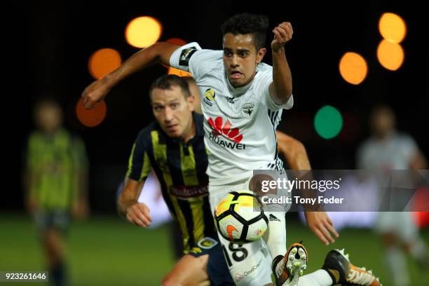 Sarpreet Singh of the Phoenix Contests the ball with Alan Baro of the Mariners during the round 21 A-League match between the Central Coast Mariners...