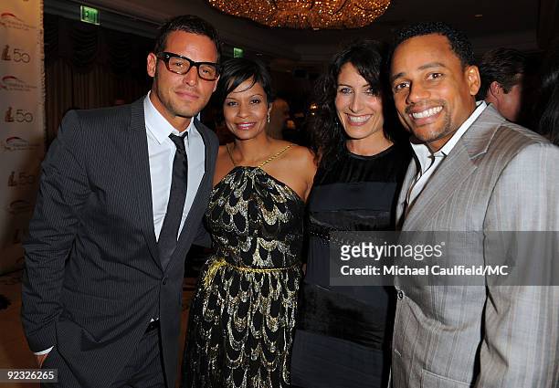 Actor Justin Chambers, his wife Keisha Chambers, actress Lisa Edelstein, and actor Hill Harper attend the Monte Carlo Television Festival cocktail...