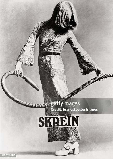 Poster "Skrein" and a vacuum cleaner hose. Austria. Photograph. 1968.