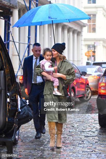 Chrissy Teigen and and her baby Luna Legend seen out and about on a rainy day in Manhattan on February 22, 2018 in New York City.