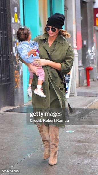 Chrissy Teigen and and baby Luna Legend seen out and about on a rainy day in Manhattan on February 22, 2018 in New York City.