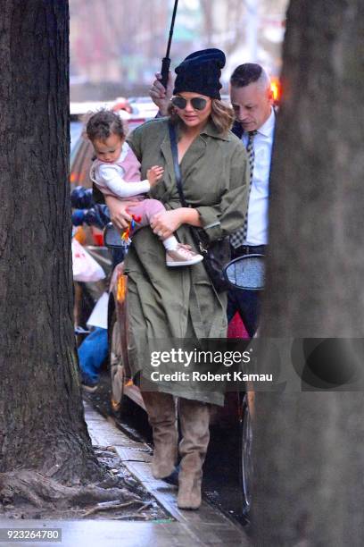 Chrissy Teigen and and baby Luna Legend seen out and about on a rainy day in Manhattan on February 22, 2018 in New York City.